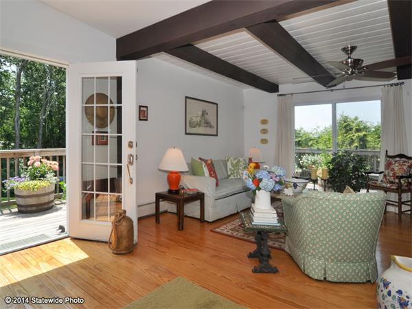 35 West Main Road Little Compton, RI 02837 - Photo 21 of 30 a living room with furniture and a floor to ceiling window