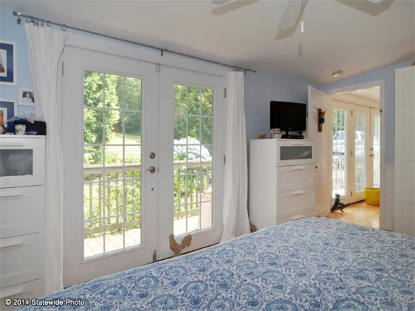 35 West Main Road Little Compton, RI 02837 - Photo 23 of 30 a bedroom with a bed and a television