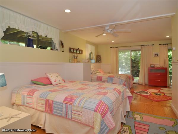 35 West Main Road Little Compton, RI 02837 - Photo 25 of 30 a bedroom with a bed and wooden floor