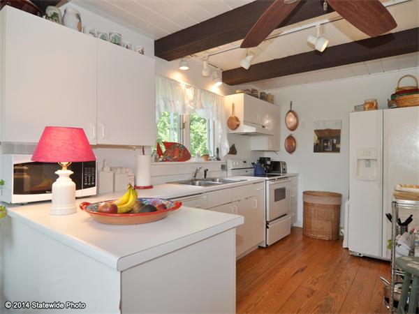 35 West Main Road Little Compton, RI 02837 - Photo 5 of 30 a kitchen with a sink appliances and cabinets