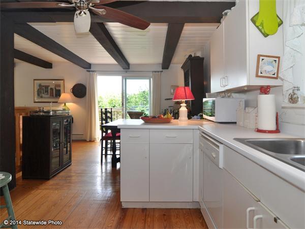35 West Main Road Little Compton, RI 02837 - Photo 7 of 30 a kitchen with a sink appliances and cabinets