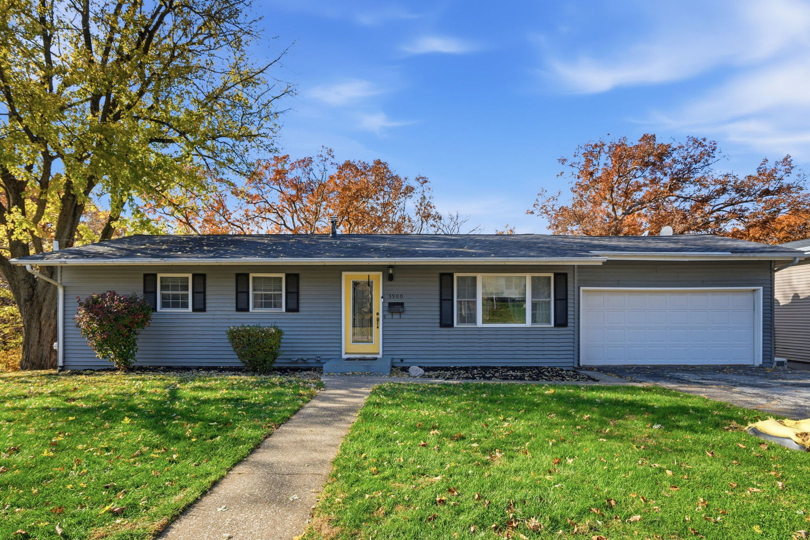 3900 28th Street Rock Island, IL 61201 - Photo 2 of 27 a front view of a house with a garden