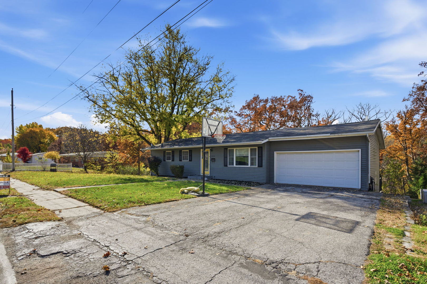 3900 28th Street Rock Island, IL 61201 - Photo 3 of 27 a front view of a house with a yard and garage