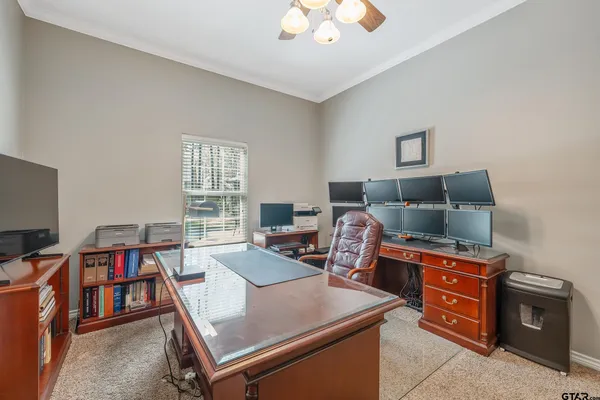 a bathroom with a bathtub shower sink mirror and toilet