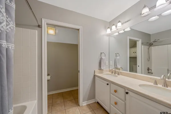 a view of a room with furniture and wooden floor