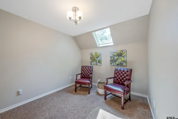a view of workspace with furniture and window