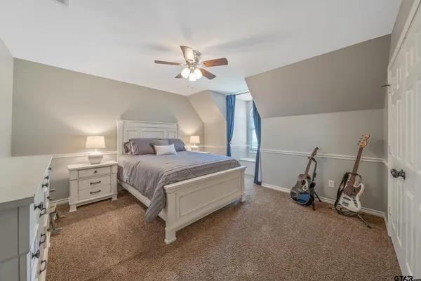 a utility room with cabinets washer and dryer