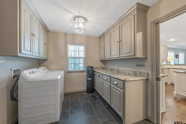 a view of a swimming pool with a table and chairs