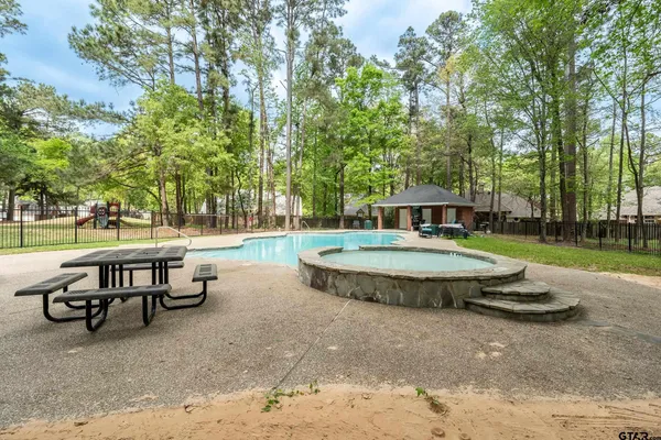 a view of a playground with basketball court