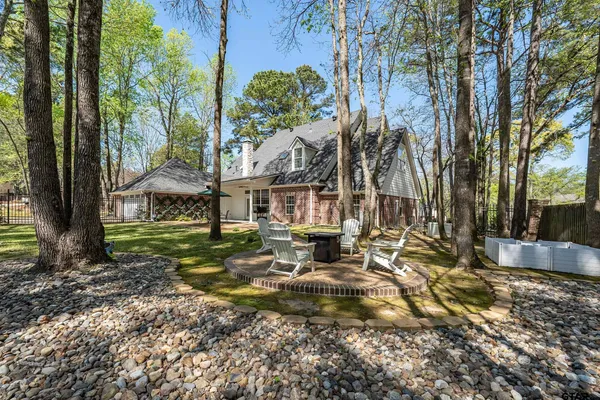 a view of a park with large trees