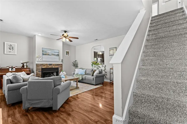 a living room with furniture and a fireplace