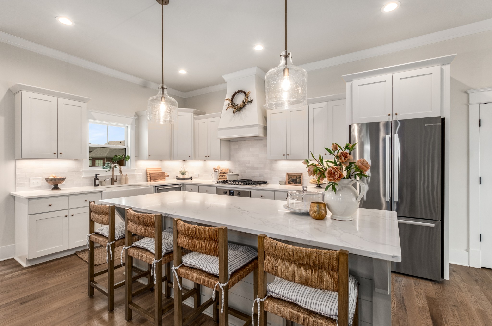 9011 Safehaven Place Spring Hill, TN 37174 - Photo 22 of 84 a kitchen with a table chairs refrigerator and microwave