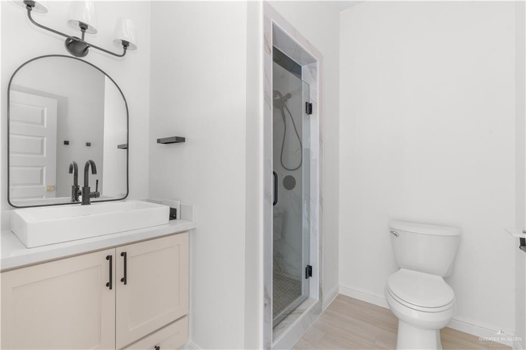 311 Other Road Rio Grande City, TX 78582 - Photo 11 of 16 Bathroom with vanity and a stall shower