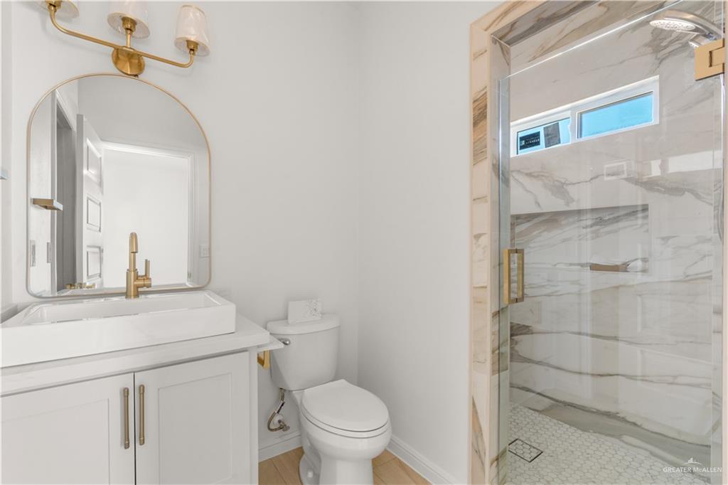 311 Other Road Rio Grande City, TX 78582 - Photo 13 of 16 Full bath featuring a marble finish shower and vanity