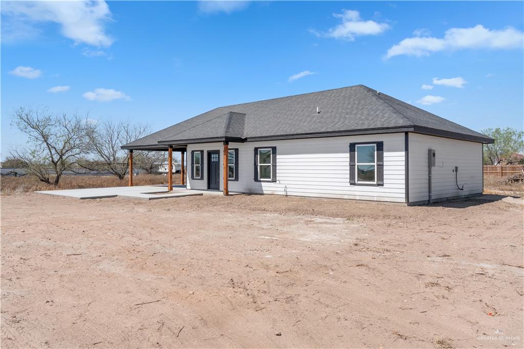 311 Other Road Rio Grande City, TX 78582 - Photo 16 of 16 Front of house featuring a patio and a shingled roof
