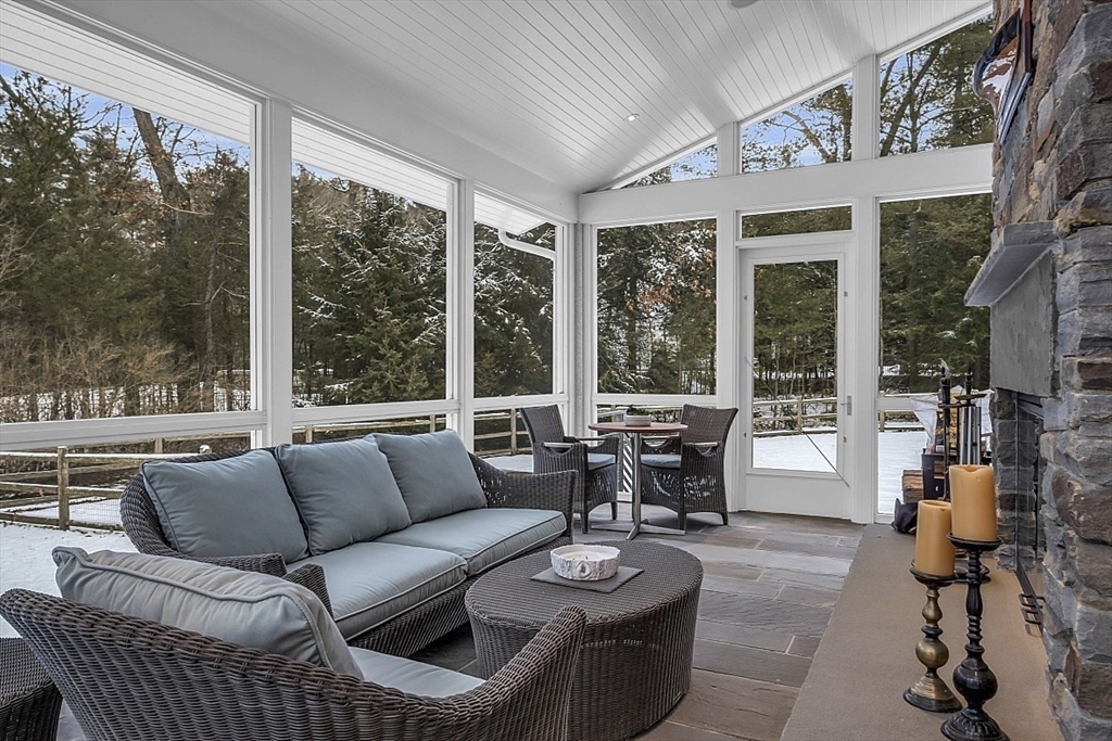 403 Simon Willard Road Concord, MA 01742 - Photo 20 of 42 a living room with furniture and a large window