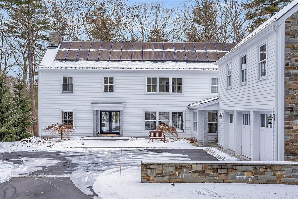 403 Simon Willard Road Concord, MA 01742 - Photo 3 of 42 a front view of a house with a yard