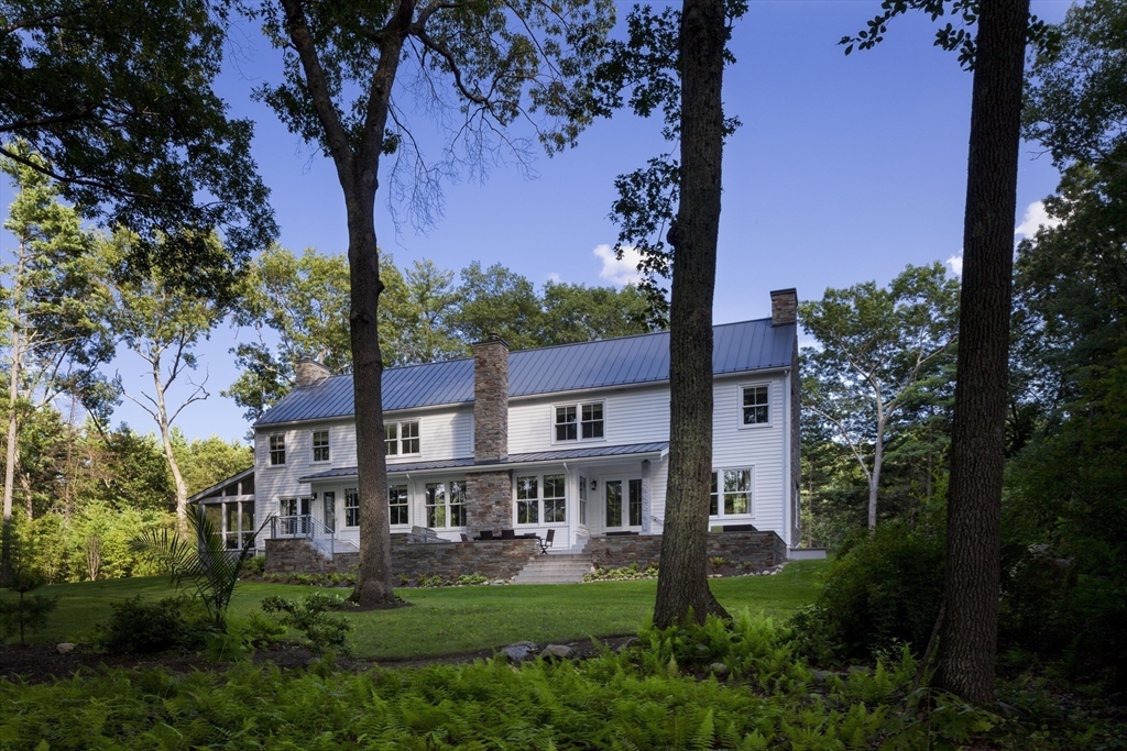 403 Simon Willard Road Concord, MA 01742 - Photo 42 of 42 front view of a house with a garden