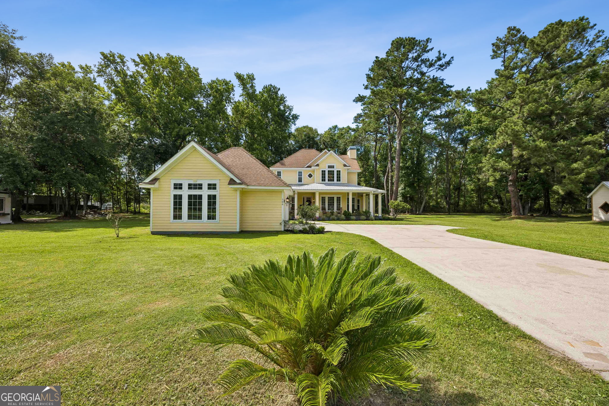 706 Hopewell Point Road White Oak, GA 31568 - Photo 50 of 84 The expansive front yard and established trees provide a sense of privacy while creating a beautiful setting to enjoy year-round.