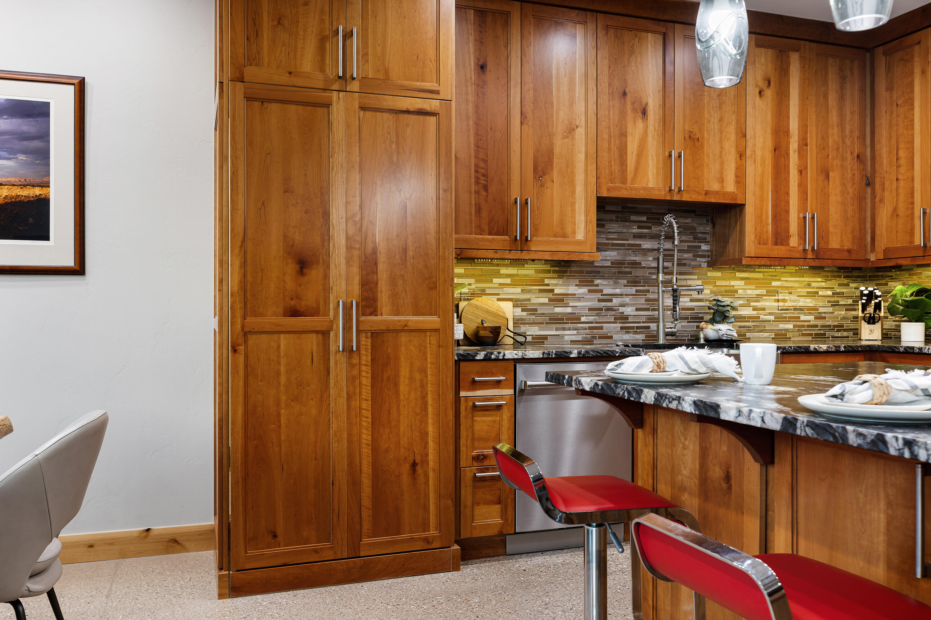 3000 Navajo Way Springdale, UT 84767 - Photo 19 of 63 Kitchen with island bar seating, leathered granite counters, and full-height cherrywood pantry cabinetry.