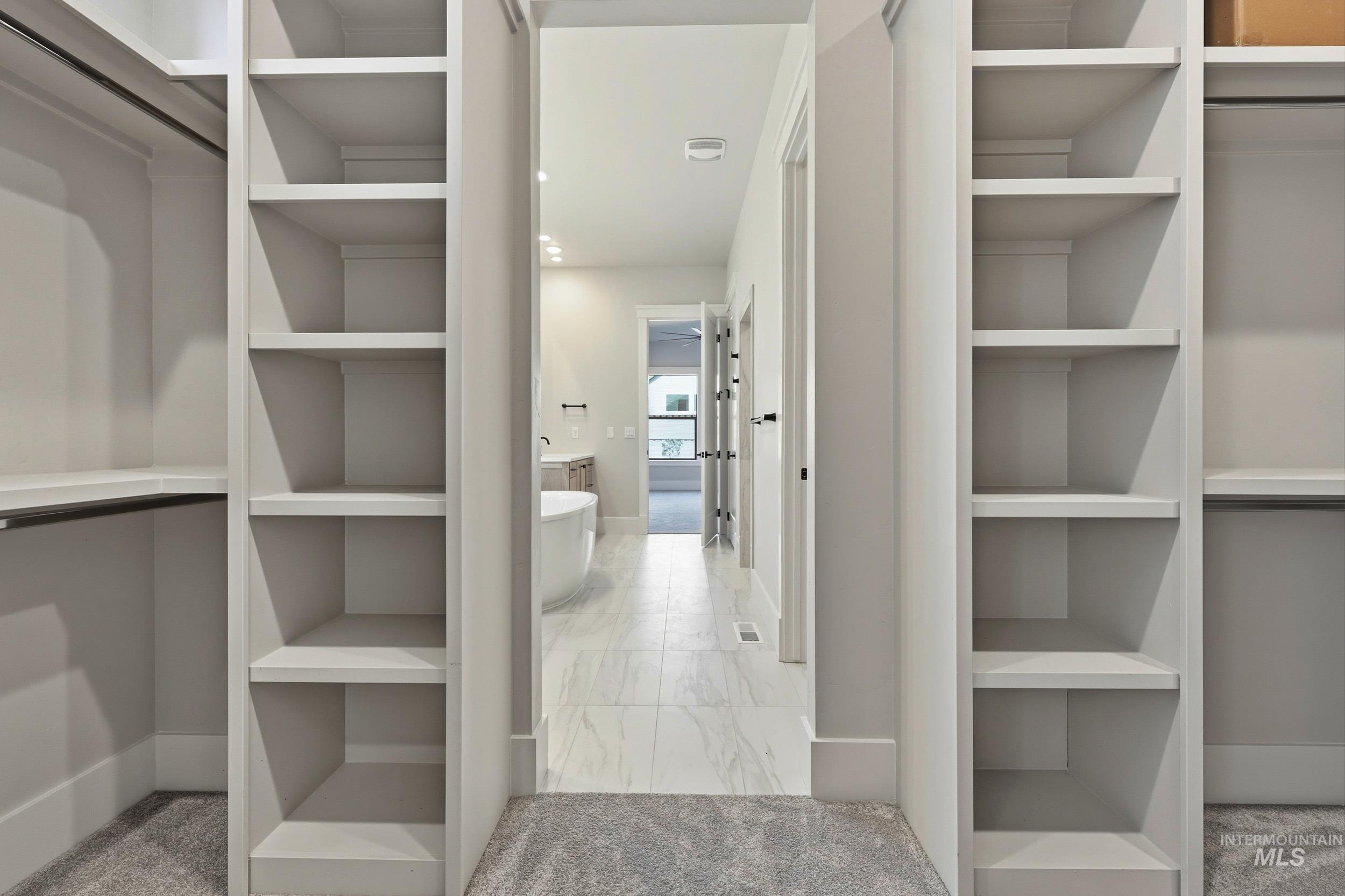 1048 East Escalation Street Meridian, ID 83642 - Photo 25 of 44 Spacious closet with light colored carpet and light marble finish floors