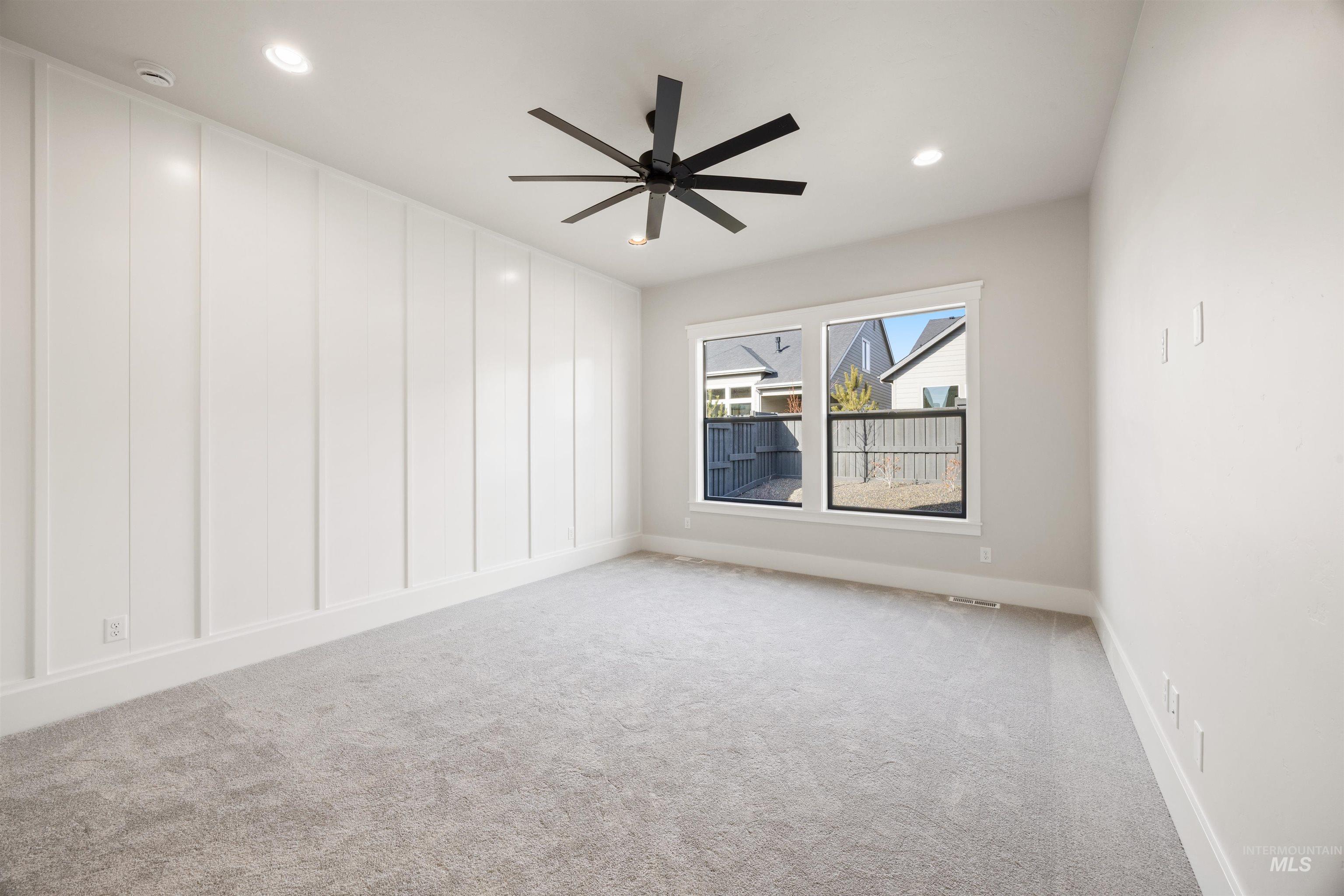 1048 East Escalation Street Meridian, ID 83642 - Photo 27 of 44 Unfurnished room featuring light colored carpet, ceiling fan, and recessed lighting