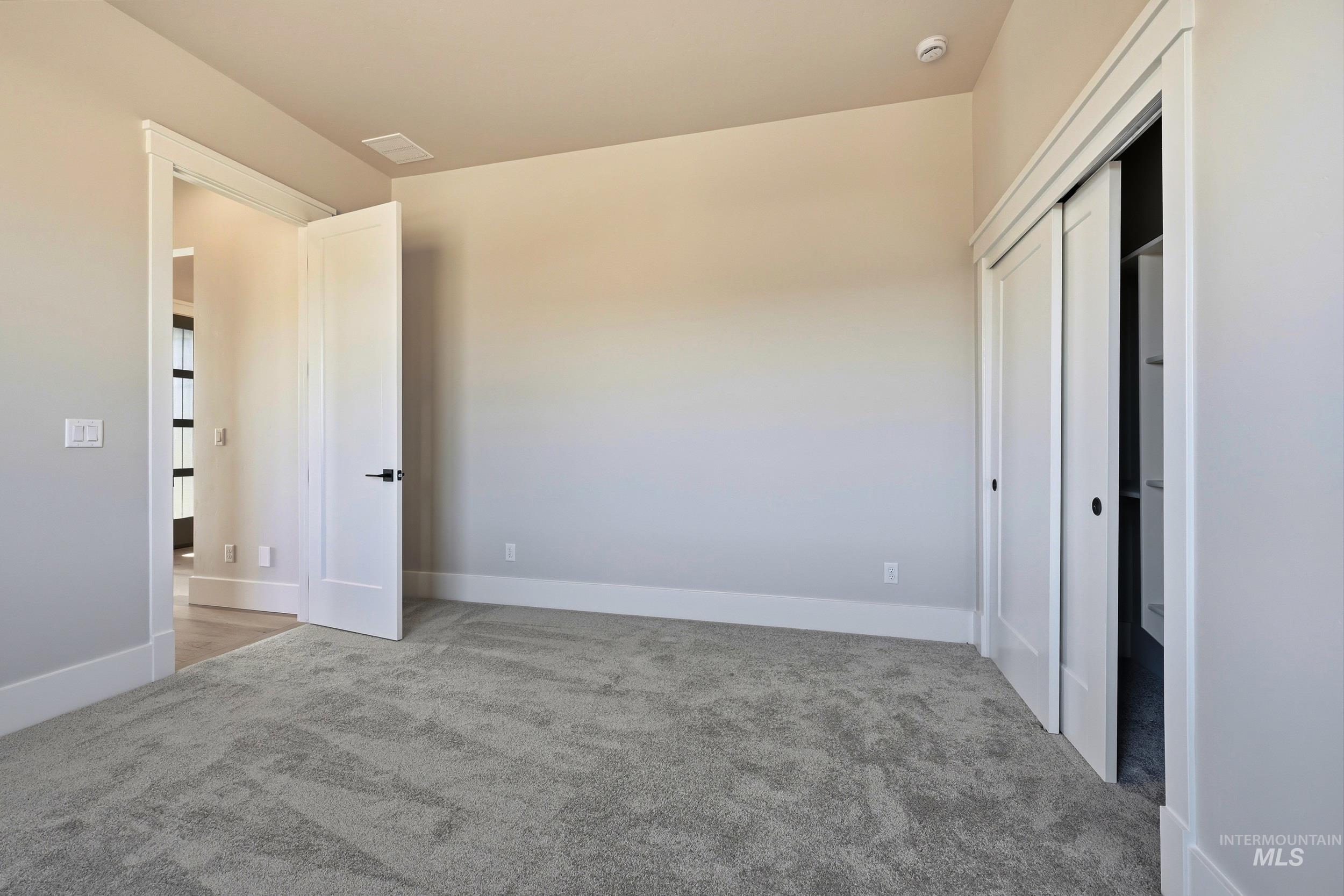 1048 East Escalation Street Meridian, ID 83642 - Photo 32 of 44 Unfurnished bedroom featuring carpet flooring and a closet
