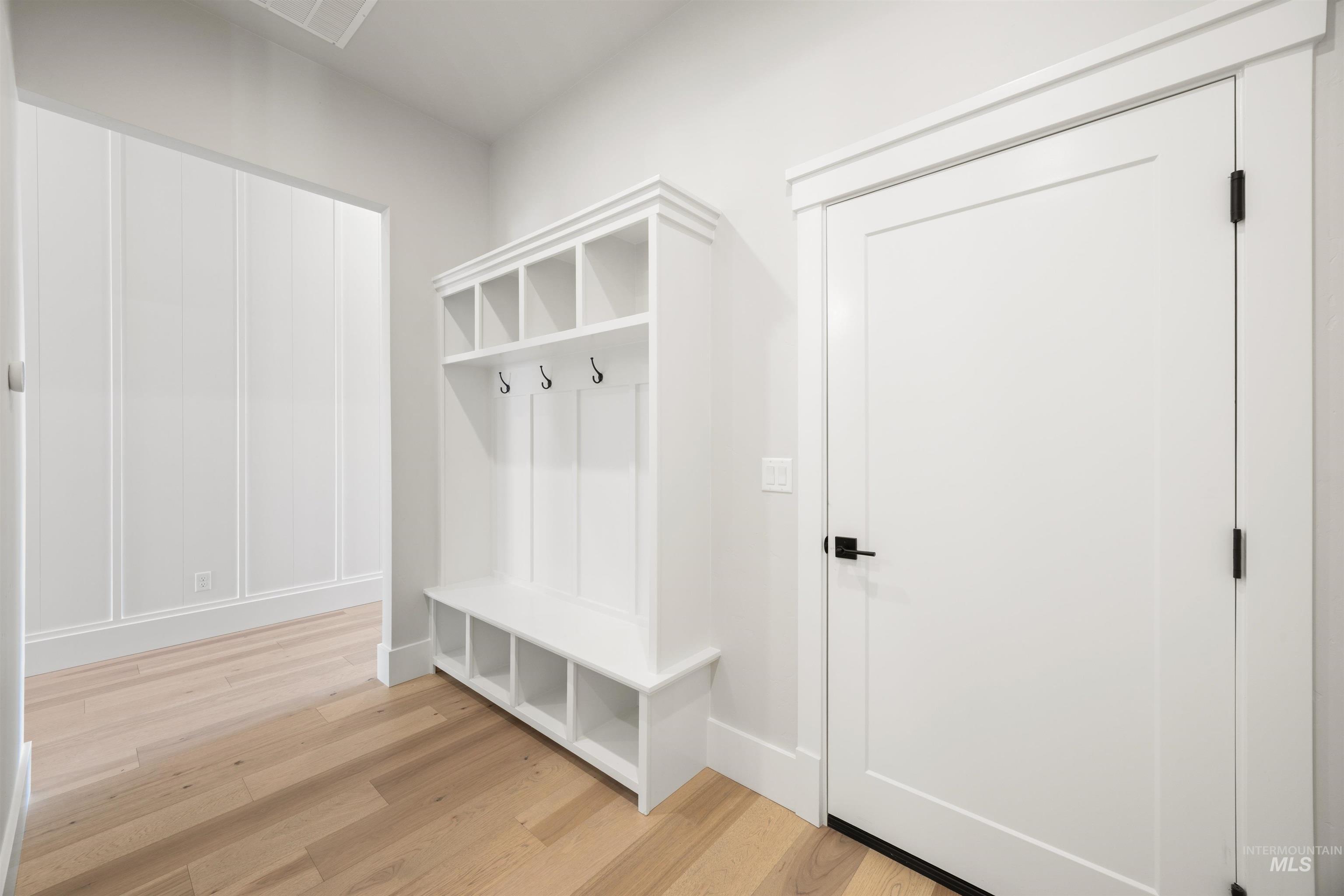 1048 East Escalation Street Meridian, ID 83642 - Photo 35 of 44 Mudroom with light wood-style flooring and baseboards