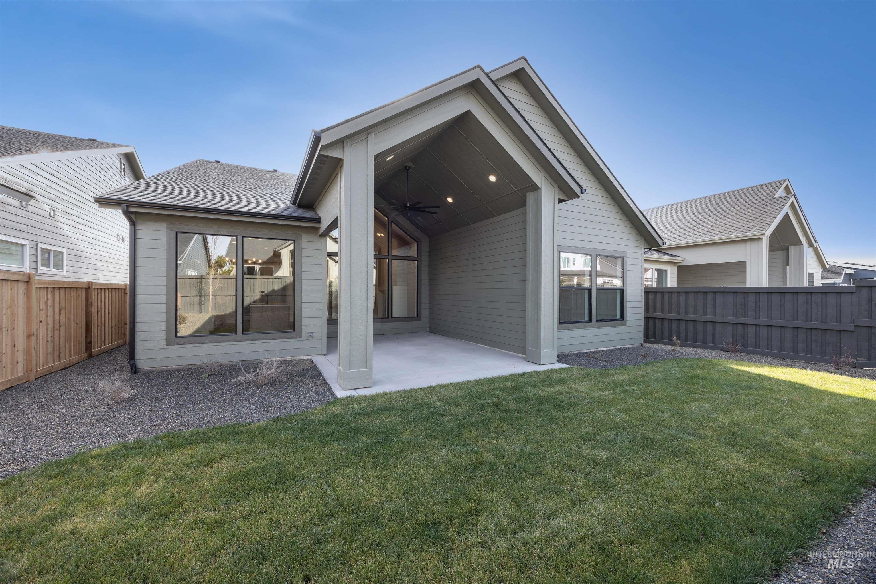 1048 East Escalation Street Meridian, ID 83642 - Photo 38 of 44 Rear view of house with a ceiling fan, a fenced backyard, a patio, and a shingled roof