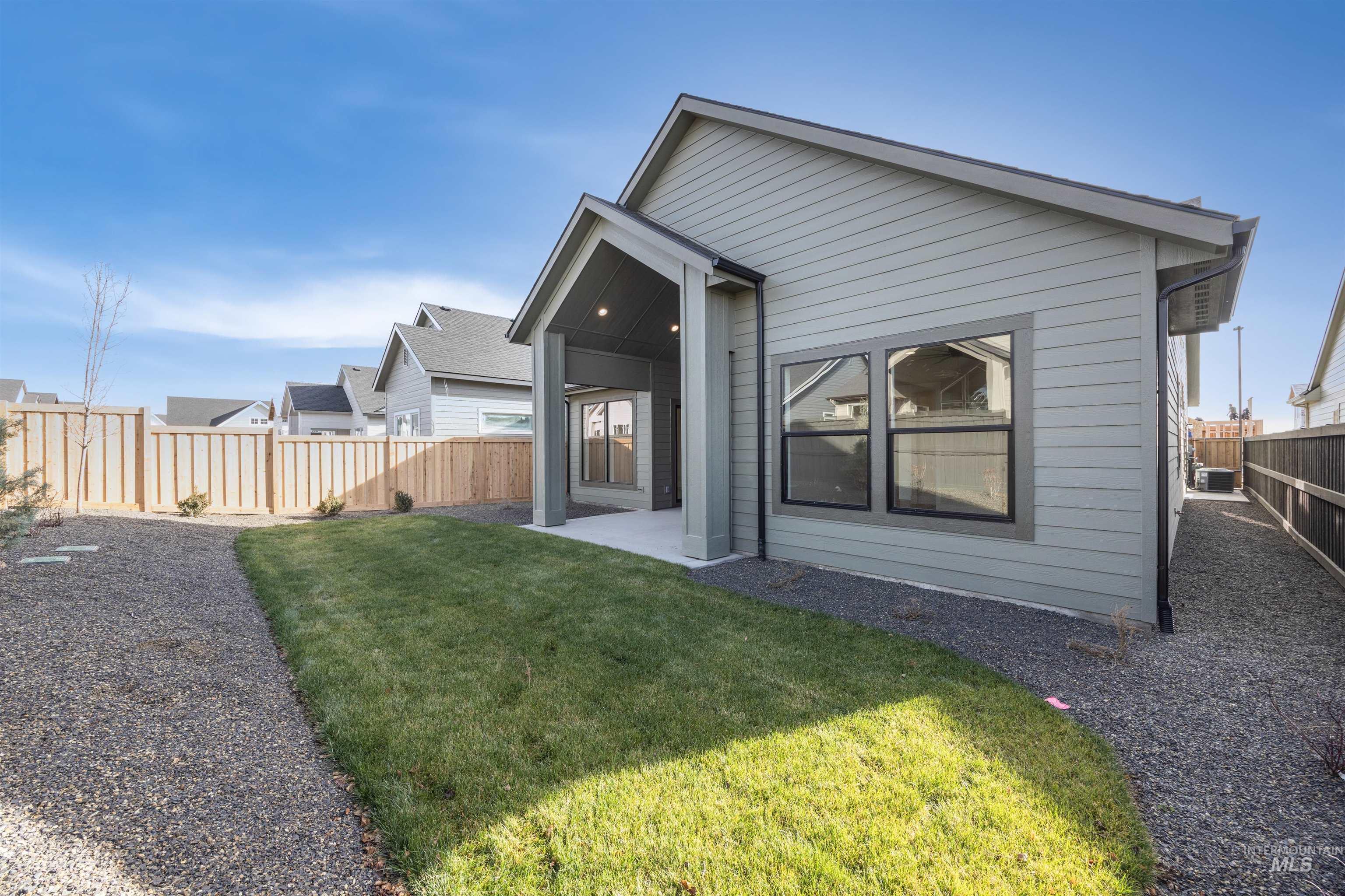 1048 East Escalation Street Meridian, ID 83642 - Photo 39 of 44 Rear view of property featuring a patio and a fenced backyard