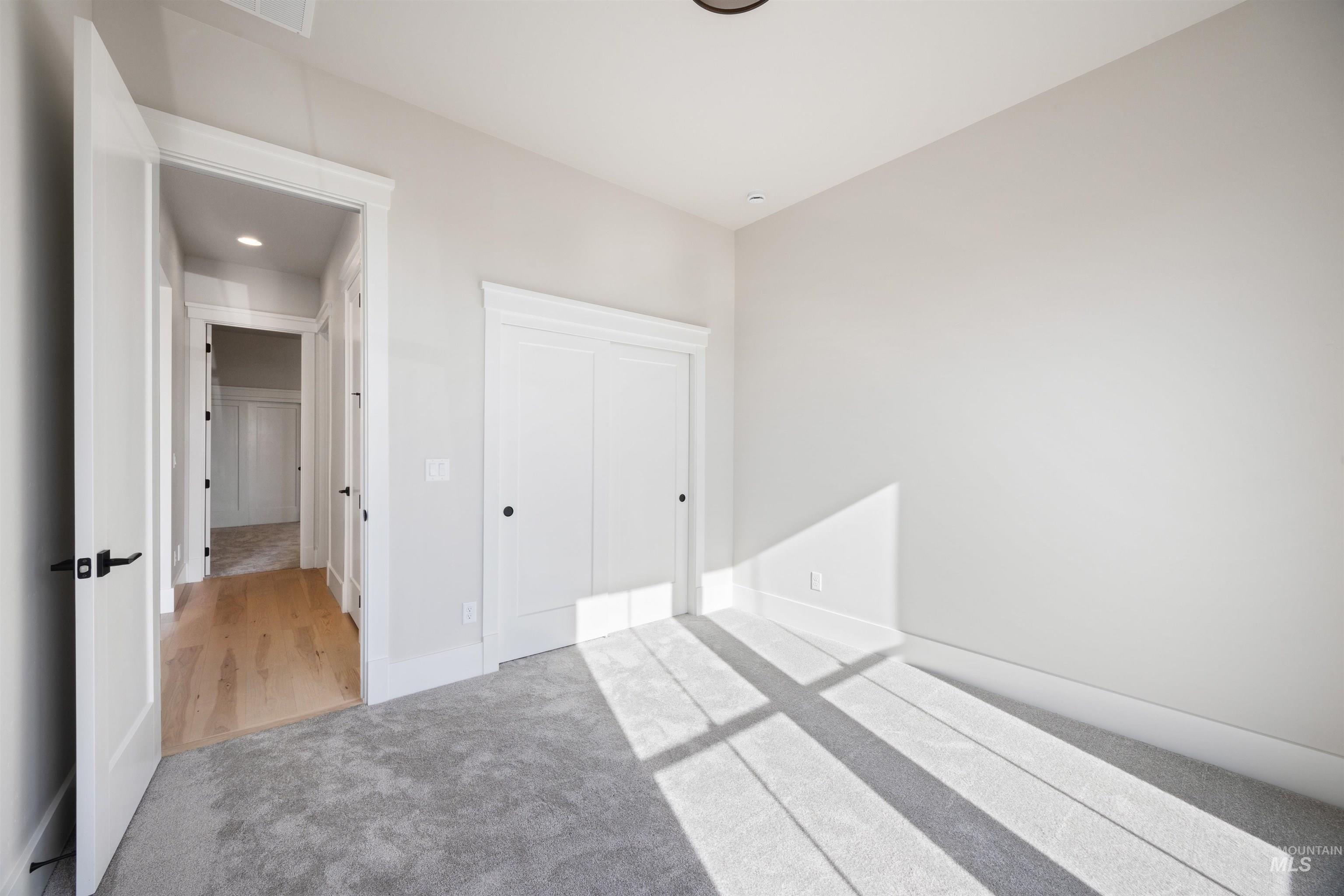 1048 East Escalation Street Meridian, ID 83642 - Photo 6 of 44 Unfurnished bedroom featuring carpet flooring and a closet