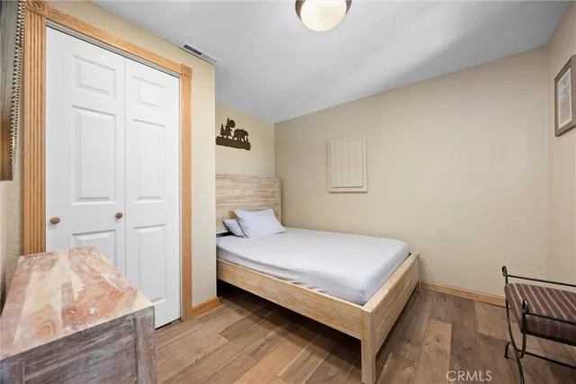 a bedroom with a bed and a view of bathroom