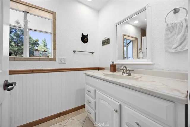 a bedroom with two beds and a window