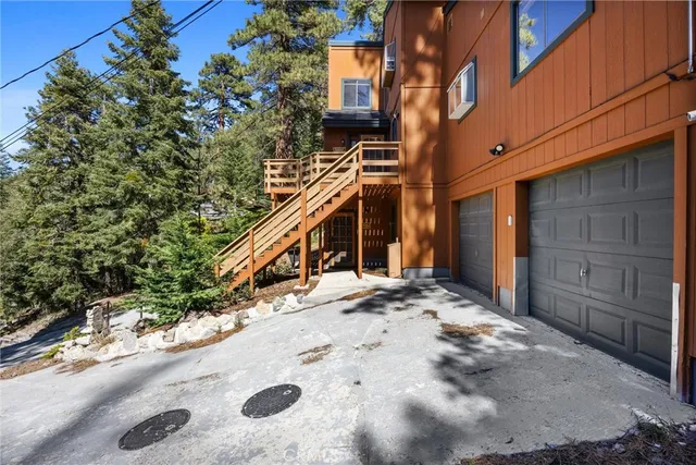 a view of a house with a snow on the road