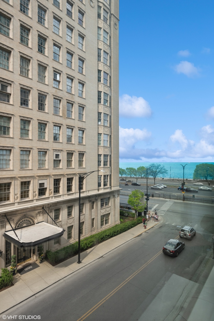 1150 North Lake Shore Drive, Unit 4H Chicago, IL 60611 - Photo 4 of 18 a view of a street with a building in the background