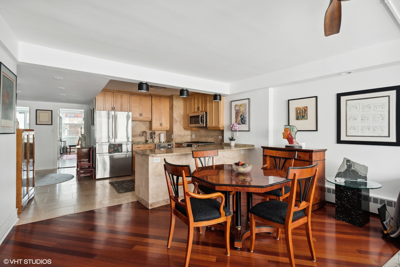 1150 North Lake Shore Drive, Unit 4H Chicago, IL 60611 - Photo 5 of 18 a view of a dining room with furniture and wooden floor