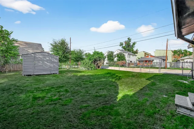 a view of a backyard with sitting area