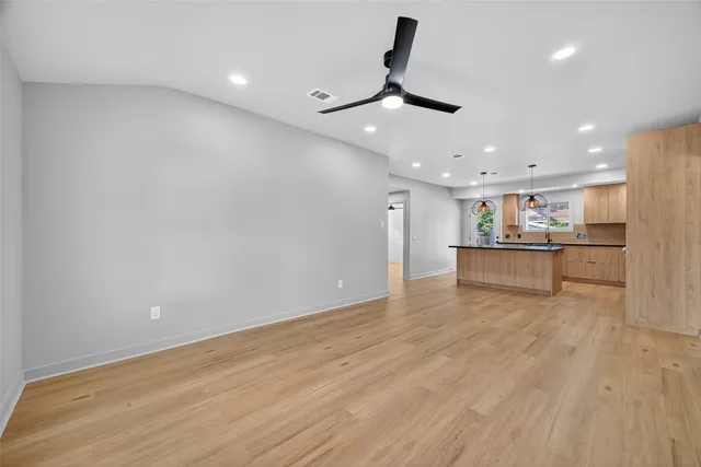 a view of a kitchen with a dishwasher and a refrigerator