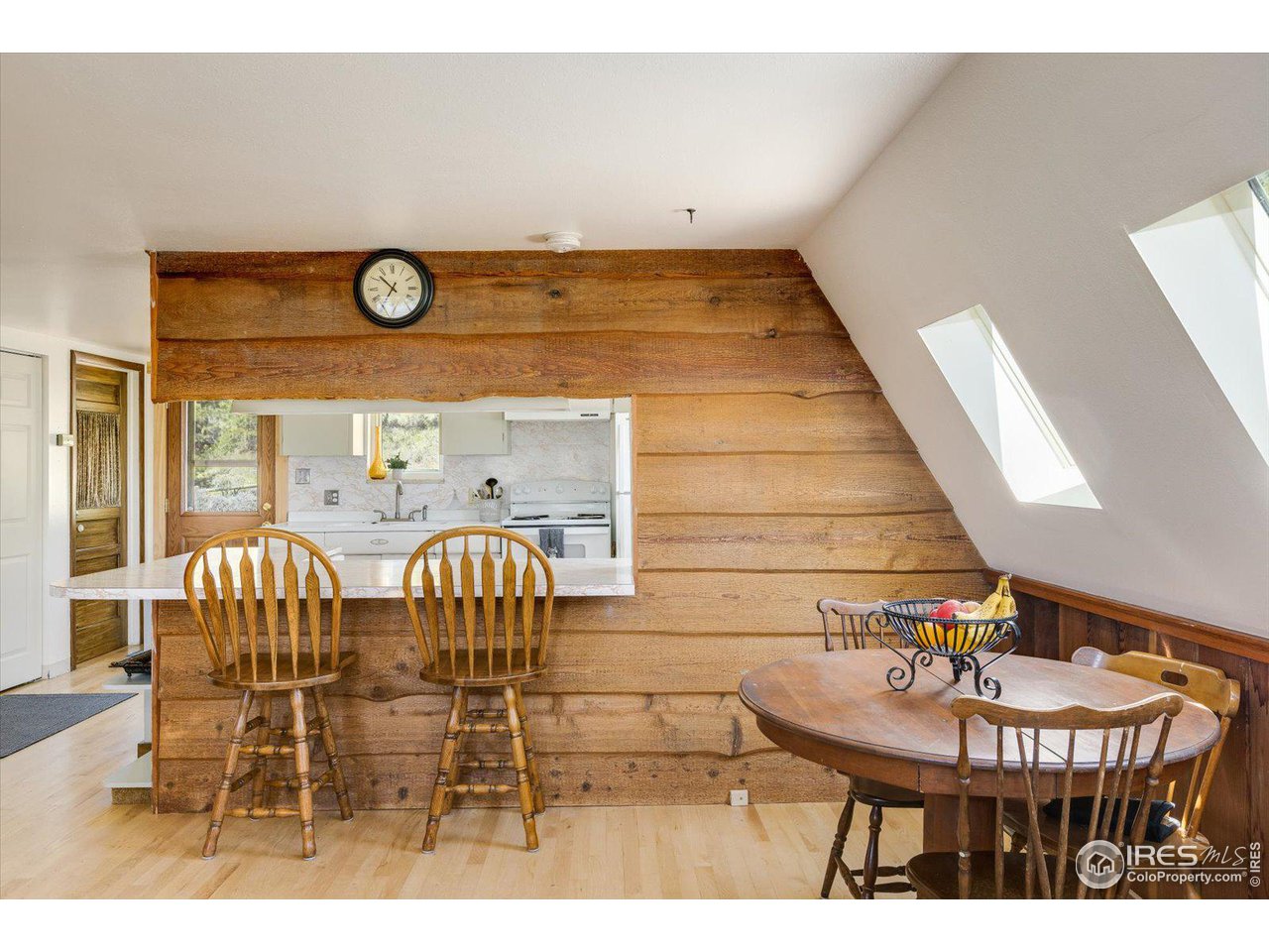 5690 Sugarloaf Road Boulder, CO 80302 - Photo 11 of 27 a view of a dining room with furniture and wooden floor