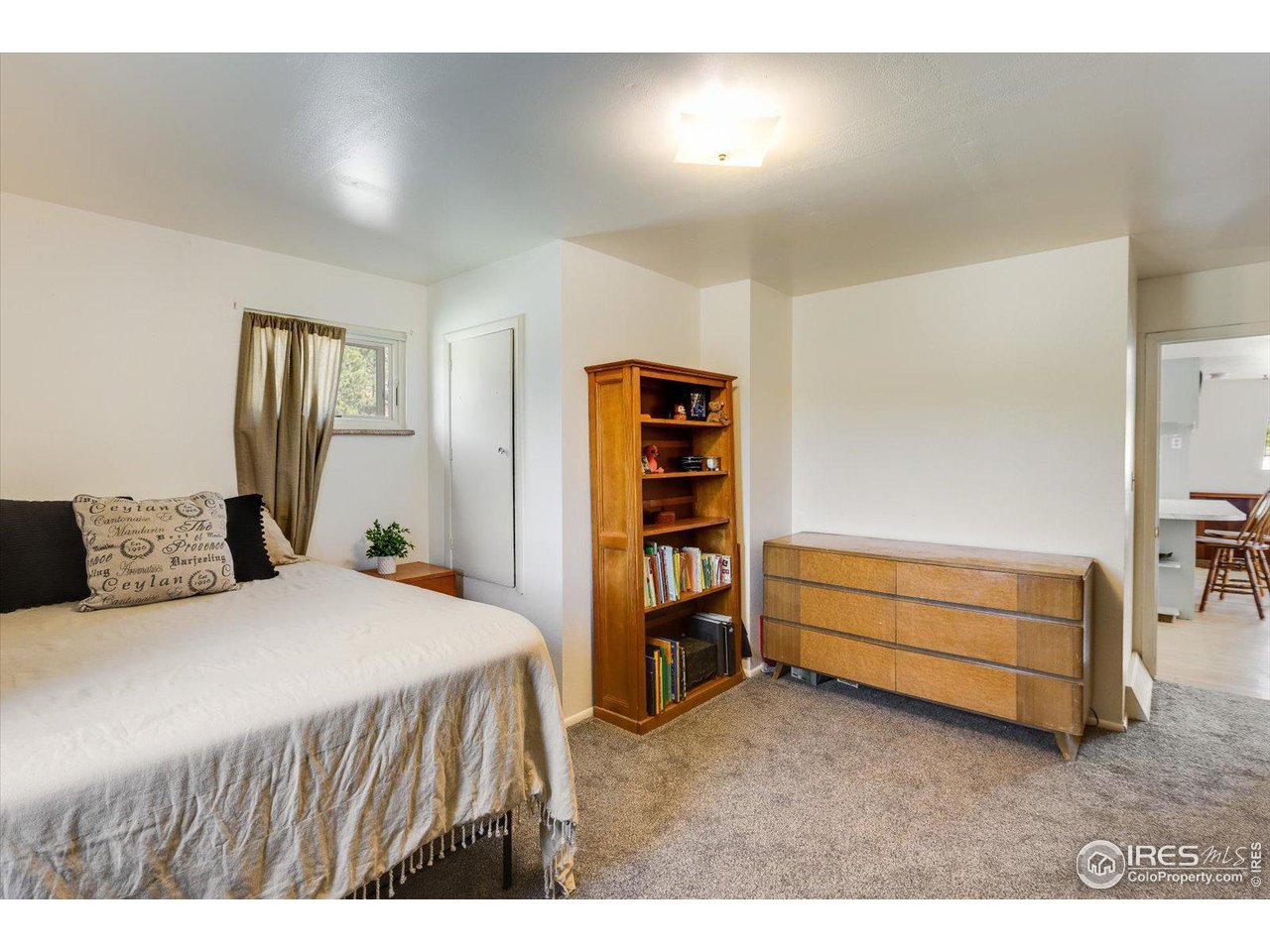 5690 Sugarloaf Road Boulder, CO 80302 - Photo 16 of 27 a bedroom with a bed and a window