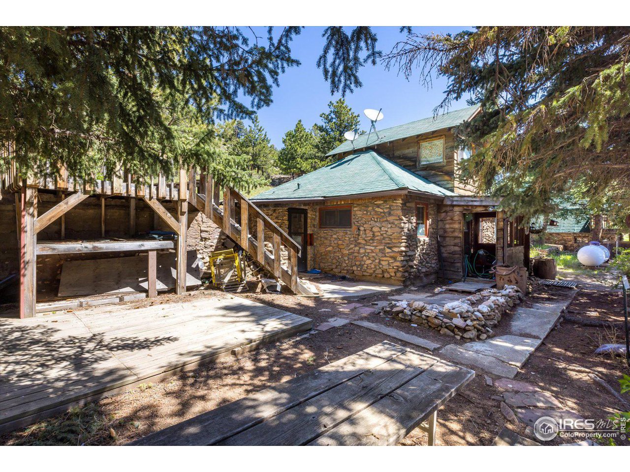 5690 Sugarloaf Road Boulder, CO 80302 - Photo 23 of 27 a house with trees in the background