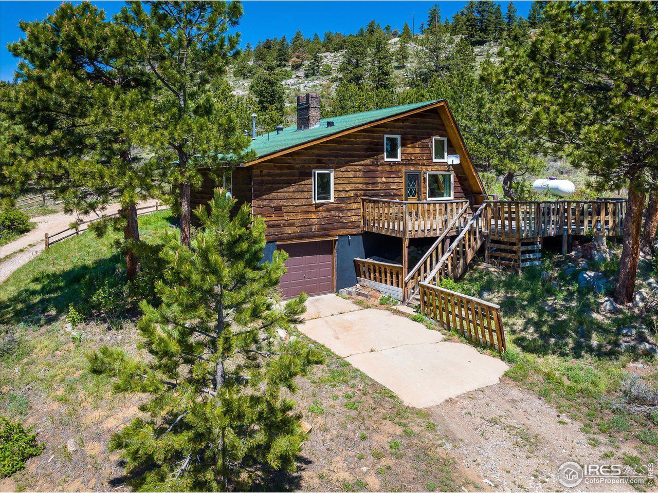 5690 Sugarloaf Road Boulder, CO 80302 - Photo 3 of 27 a front view of a house with a yard