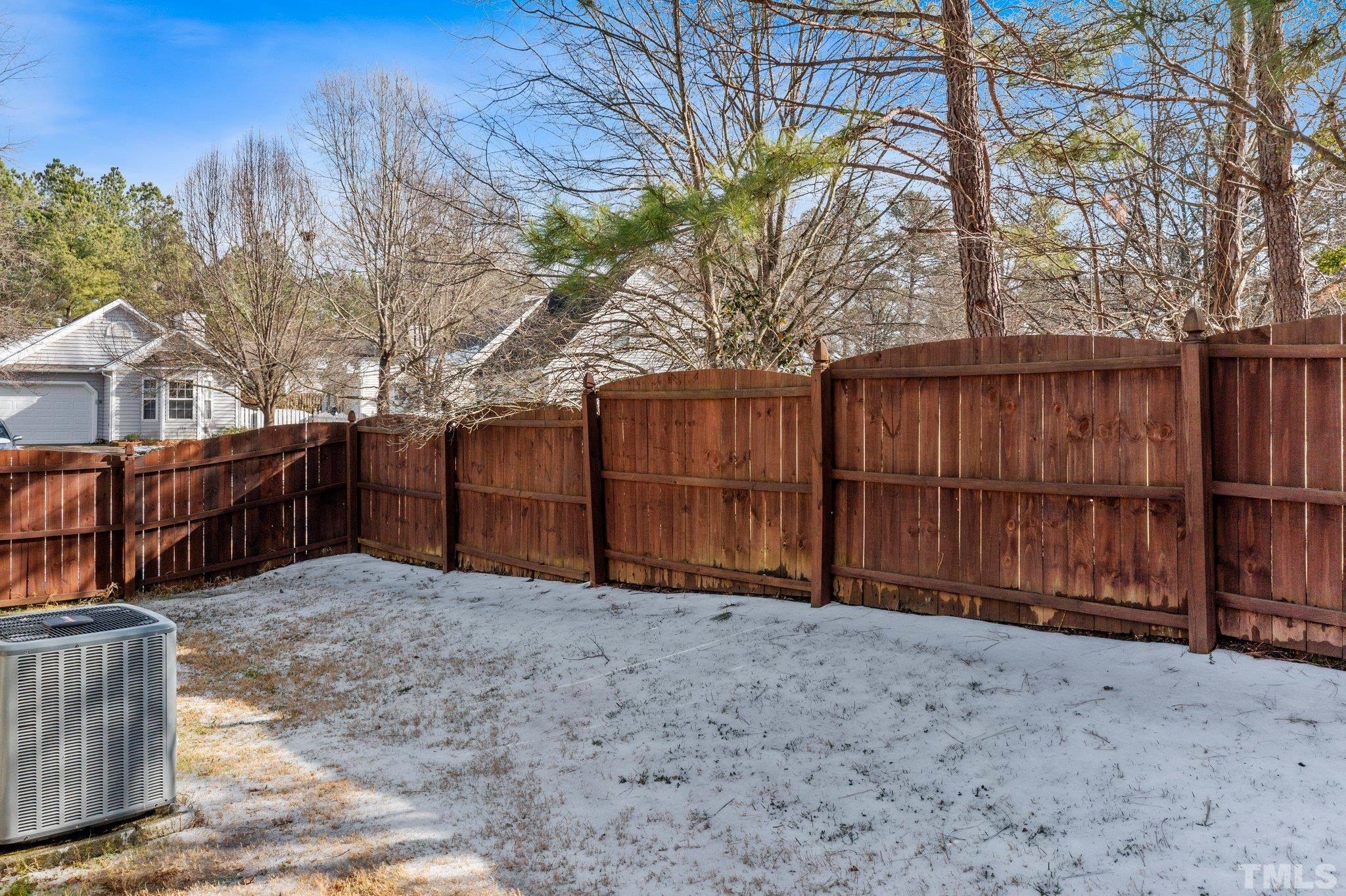 5022 Silhouette Drive Durham, NC 27713 - Photo 21 of 26 a view of backyard with wooden fence