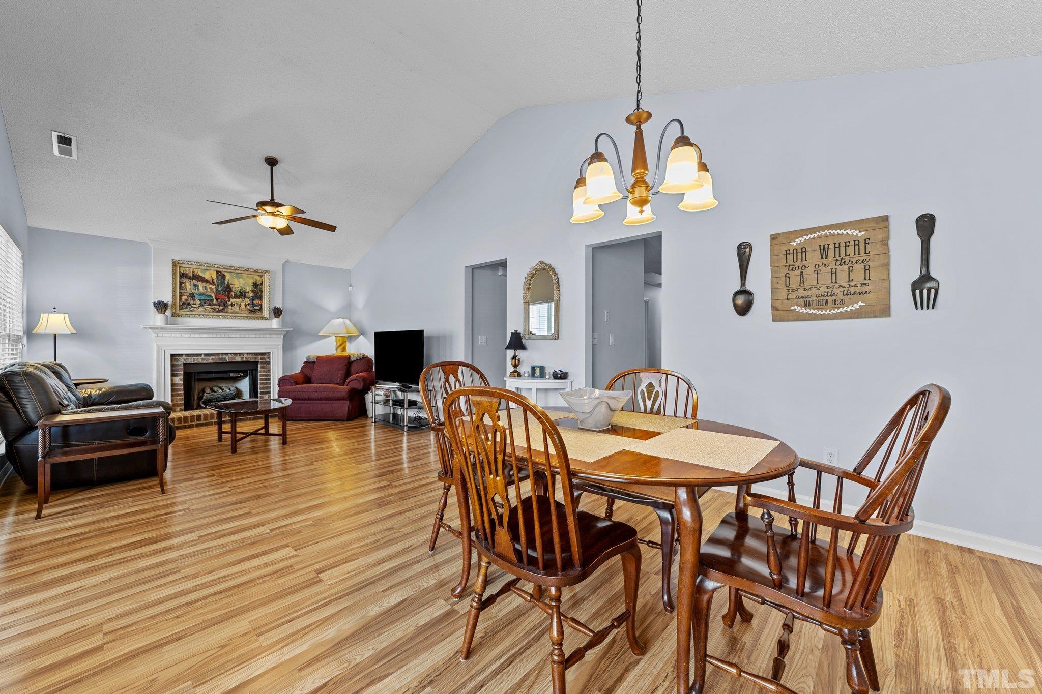 5022 Silhouette Drive Durham, NC 27713 - Photo 5 of 26 a view of a dining room with furniture window and wooden floor