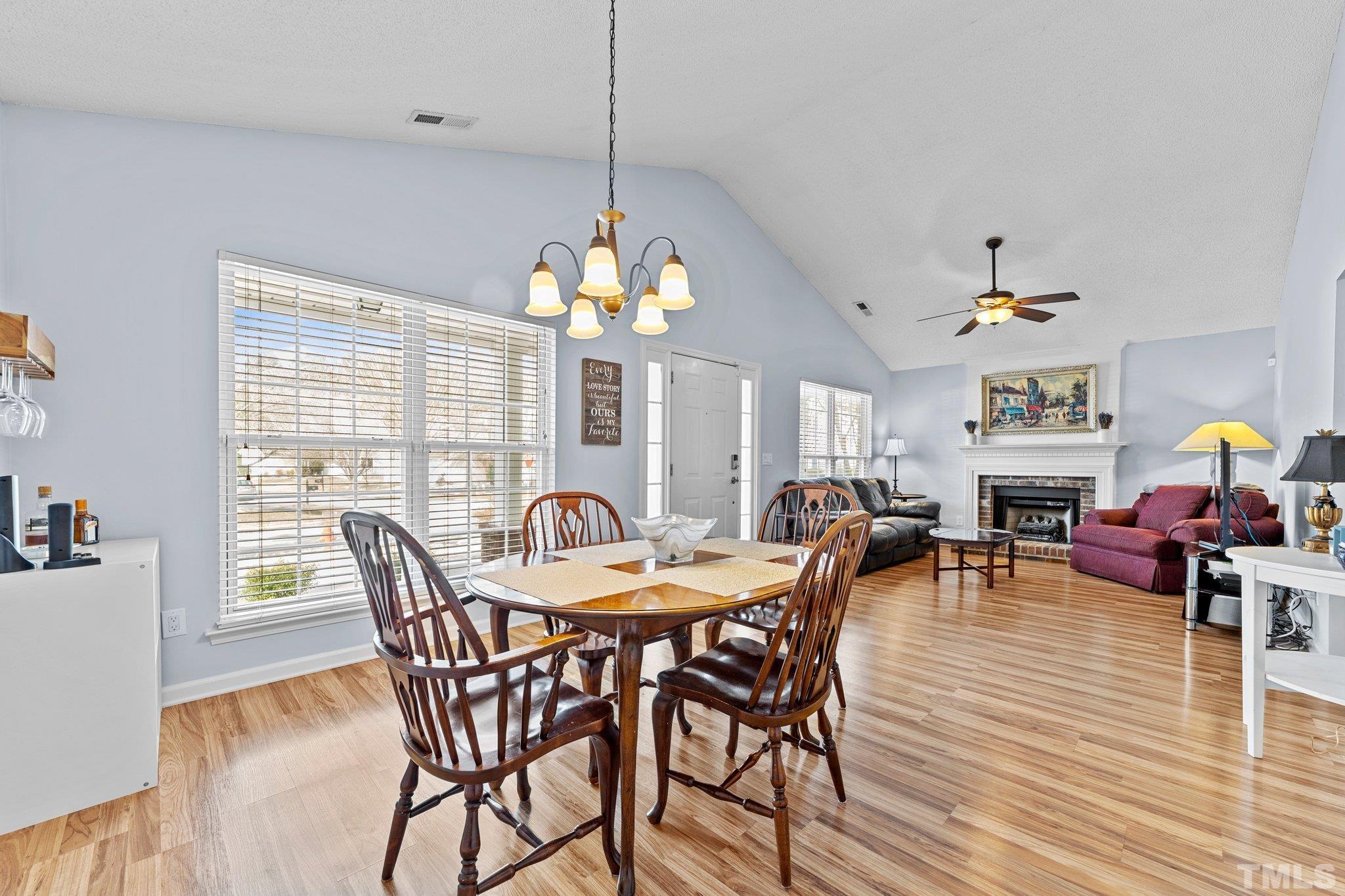5022 Silhouette Drive Durham, NC 27713 - Photo 6 of 26 a view of a dining room with furniture window and wooden floor