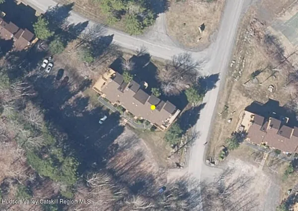 a view of a street with a yard