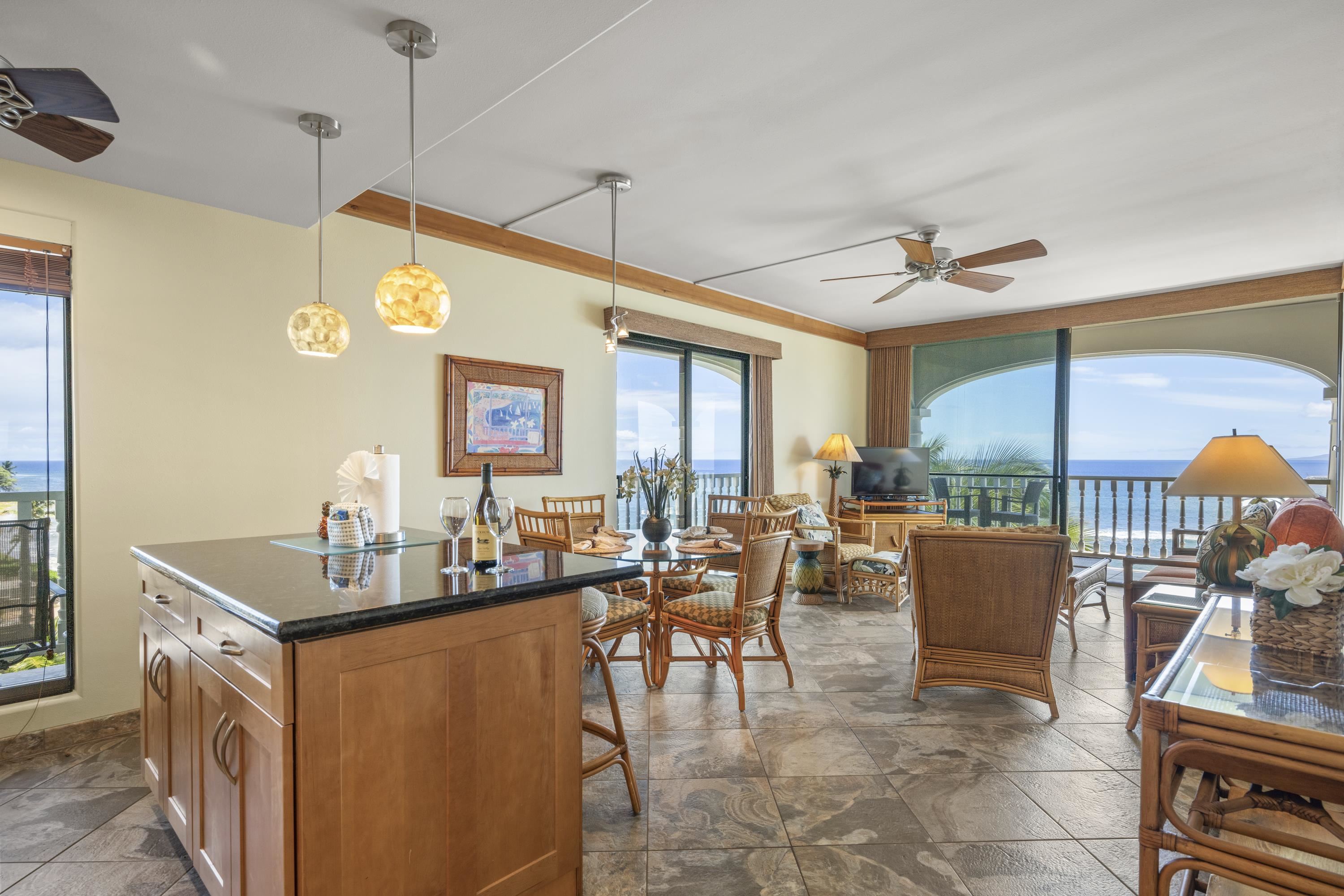 475 Front Street, Unit 601 Lahaina, HI 96761 - Photo 1 of 24 a dining hall with furniture kitchen view and a large window