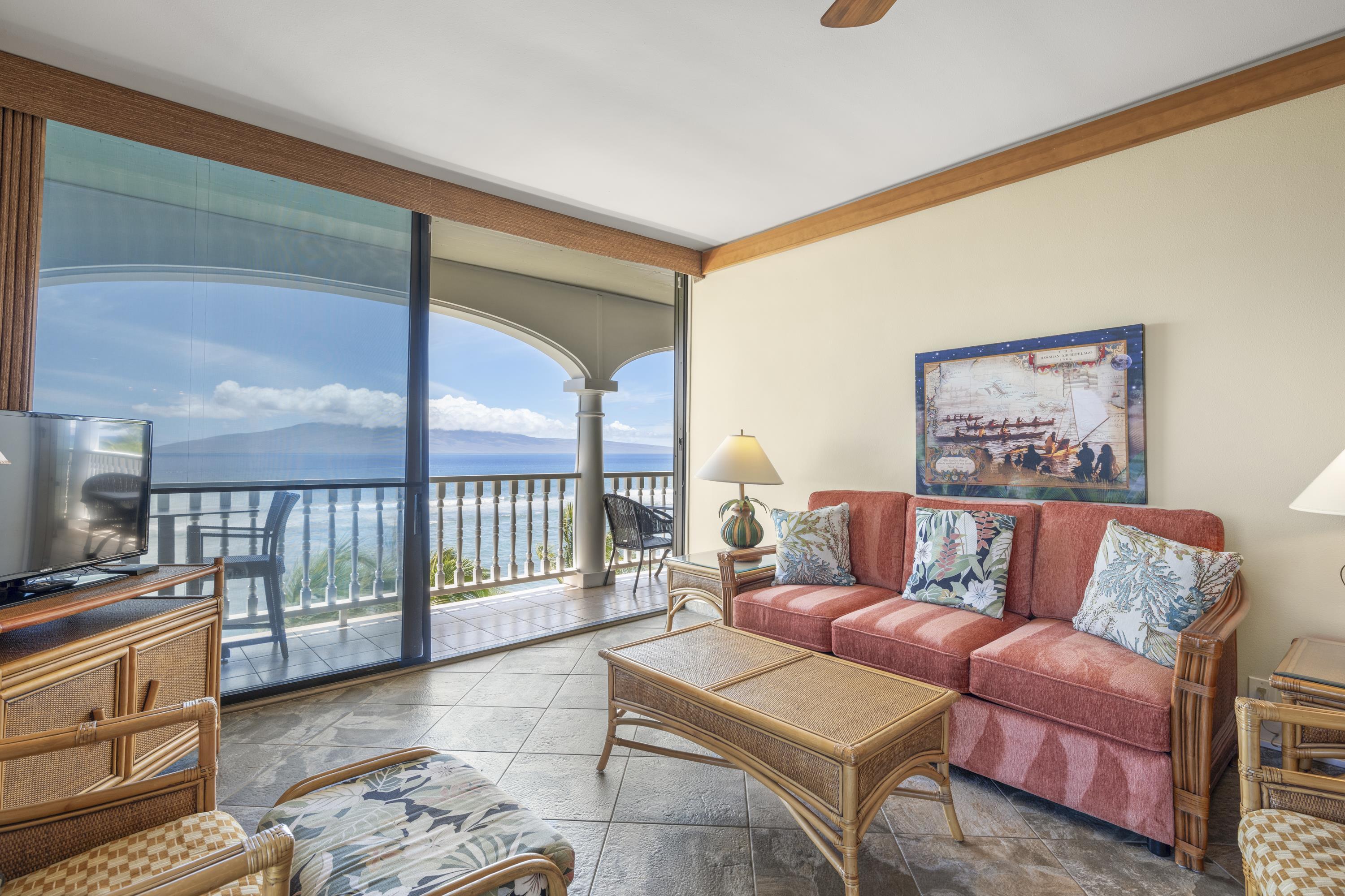 475 Front Street, Unit 601 Lahaina, HI 96761 - Photo 15 of 24 a living room with furniture and a large window