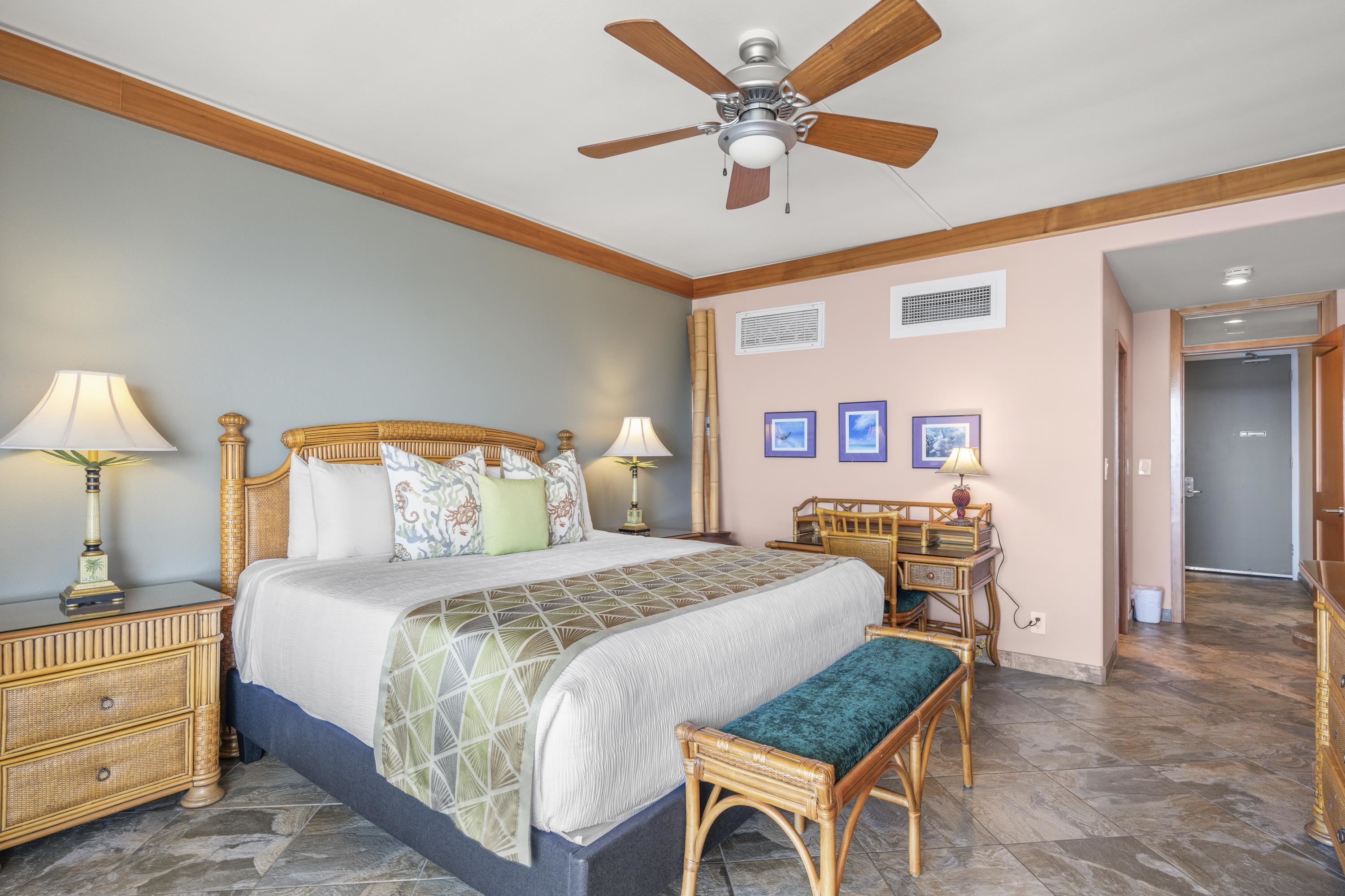 475 Front Street, Unit 601 Lahaina, HI 96761 - Photo 19 of 24 a bedroom with a bed and a chandelier