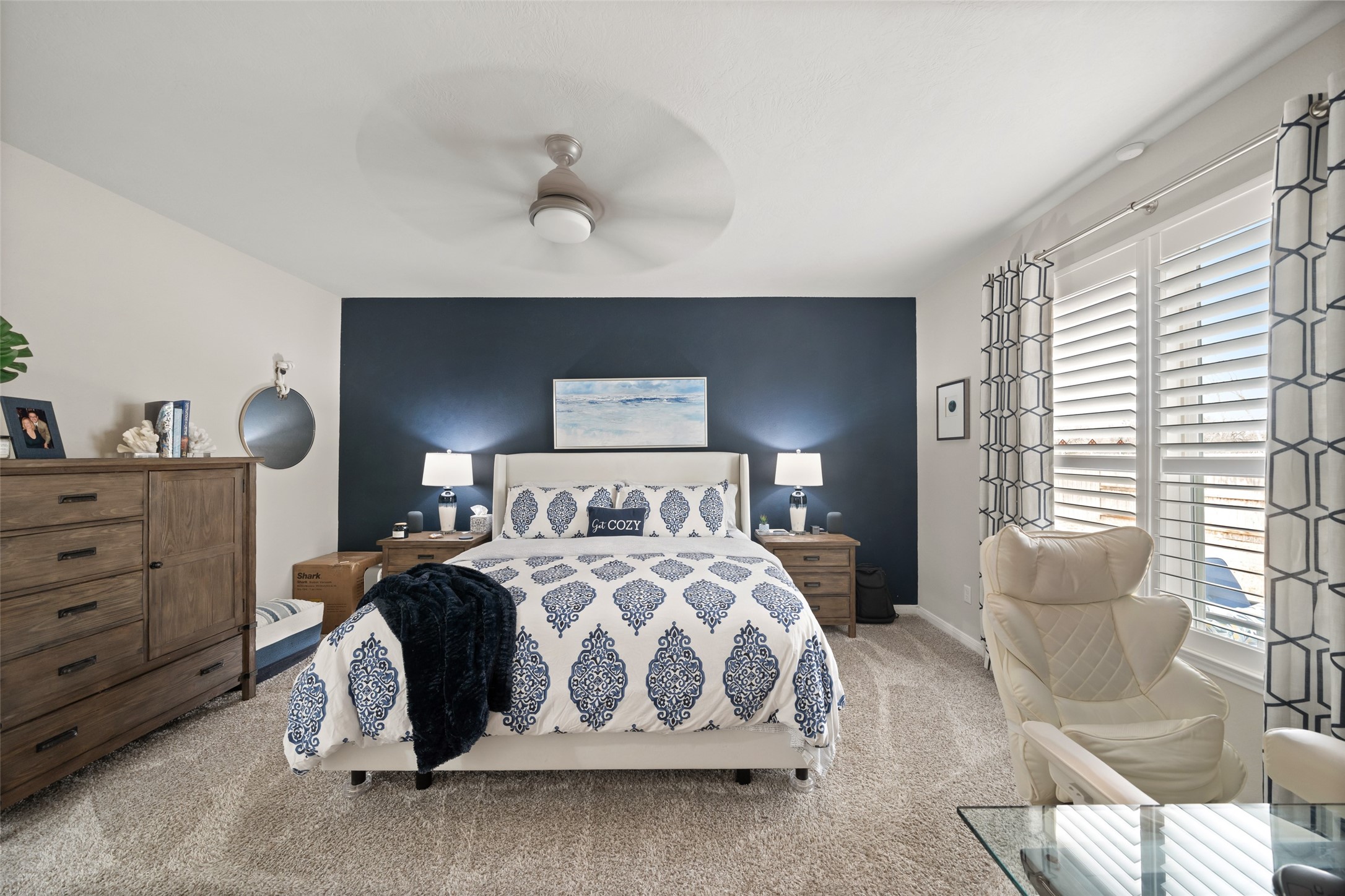 1300 Kingsgate Drive Bryan, TX 77807 - Photo 16 of 30 Primary bedroom with designer wall and plantation shutters and custom drapes